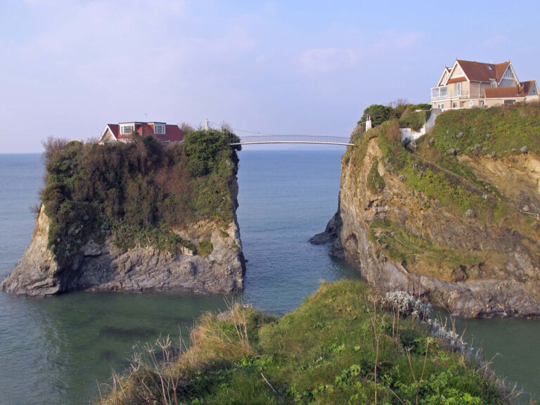 Hike from Newquay Station to Trevelgue Head and enjoy stunning coastal views and history.